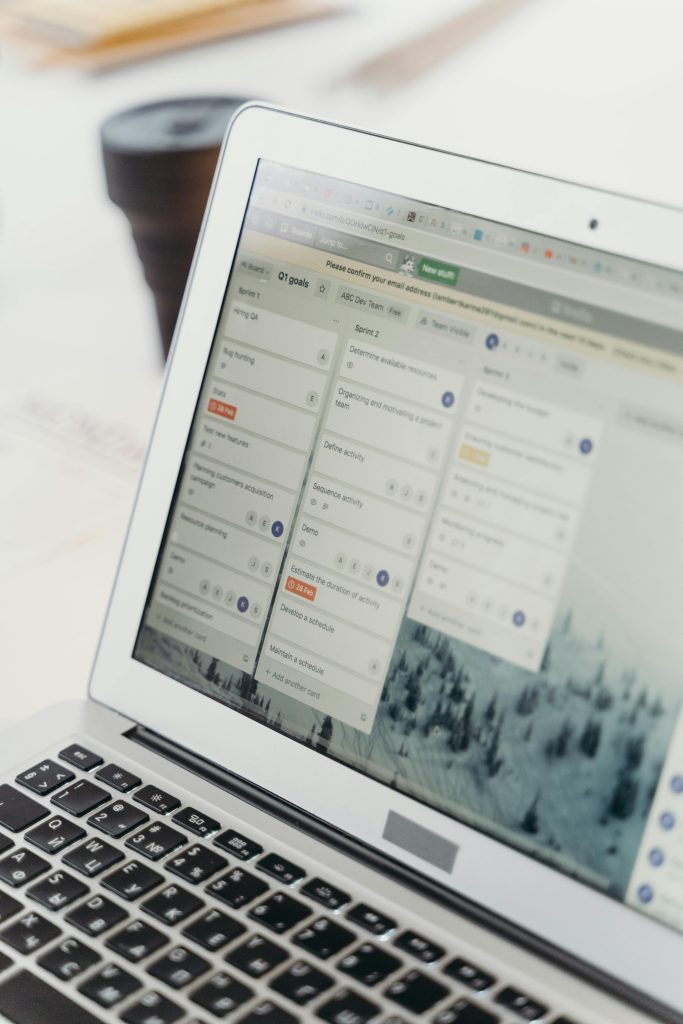 Case Management & Legal Operations Systems Close-up of a laptop screen showing project management software interface. Perfect for business or tech themes.